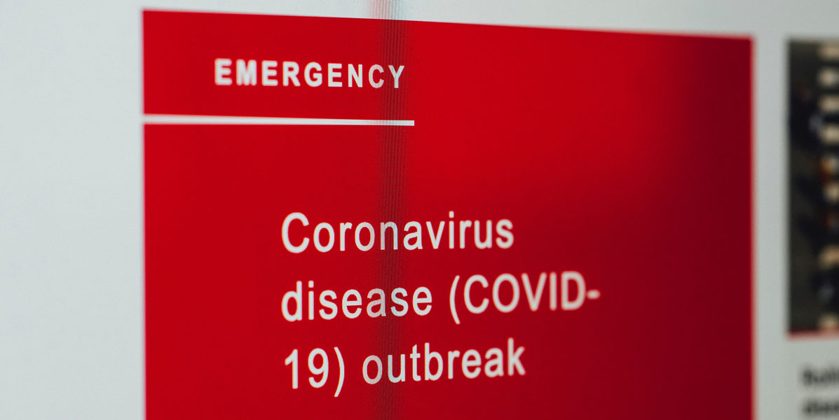 Blog_Corona_Beschäftigte Symbolbild: Schild mit Schriftzug "Corona disease"